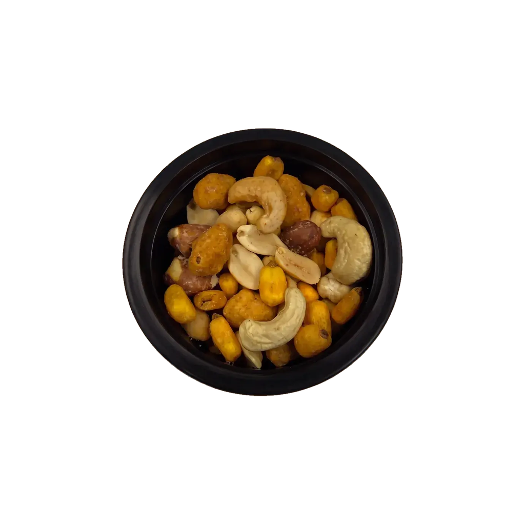 The Classic – Nuss-Mix mit Cashews, Erdnüssen, Maiskernen und Paprika-Erdnüssen in der offenen Schale von oben