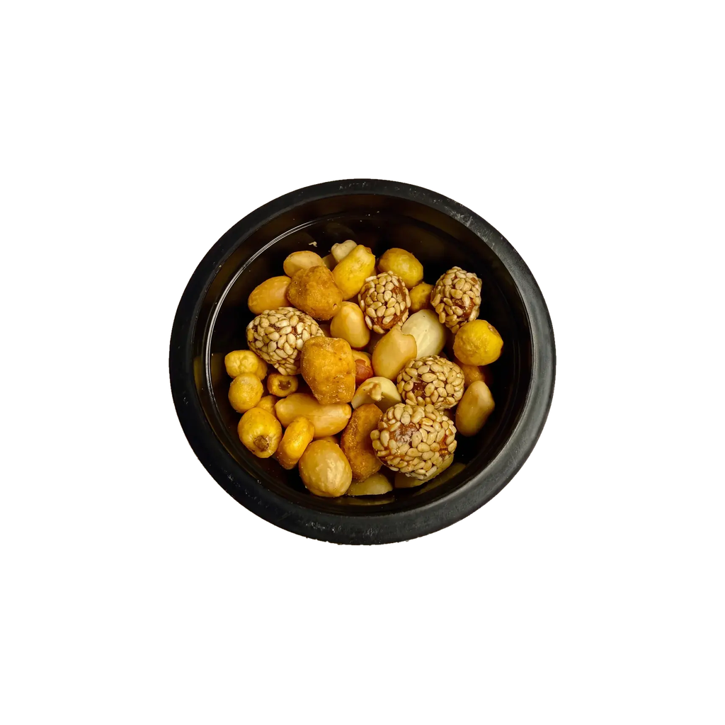 The Sweet – Nuss-Mix mit Sesam-Erdnüssen in der offenen Schale von oben
